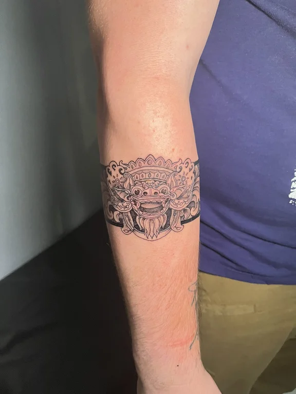 ornamental balinese lion linework cloud balinese pattern dotwork heavy shading tattoo Canggu Bali