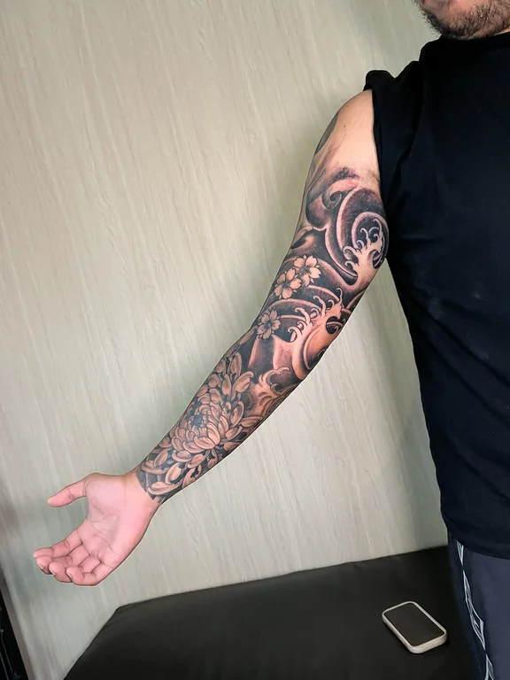 koi black grey elegant heavy shading linework soft shading full fullsleeve full sleeve tattoo canggu bali