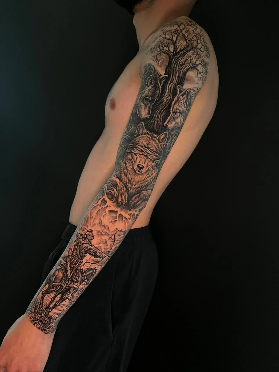 man hand full sleeve full wolves mythology black realism big tattoo canggu bali