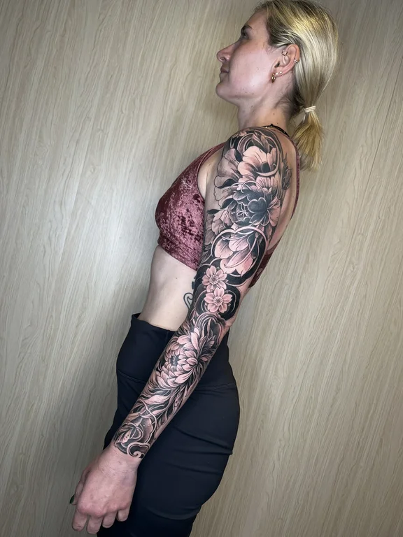 peony linework elegant heavy shading black grey woman full fullsleeve full sleeve tattoo canggu bali