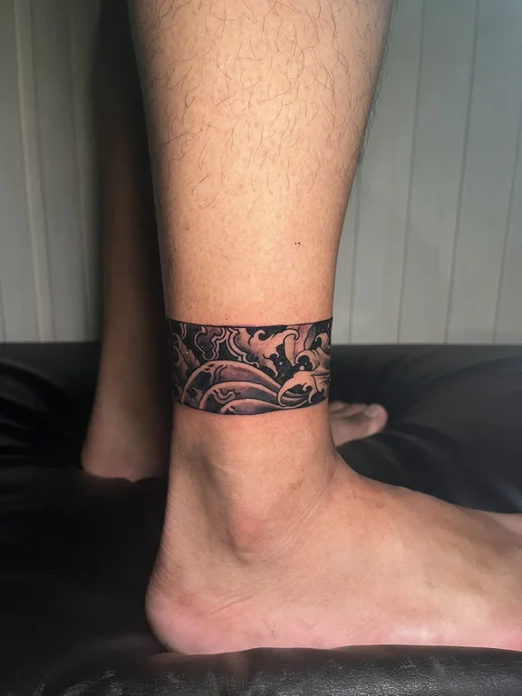 abstract blackwork snake linework wave fine line elegant dotwork tattoo Canggu Bali