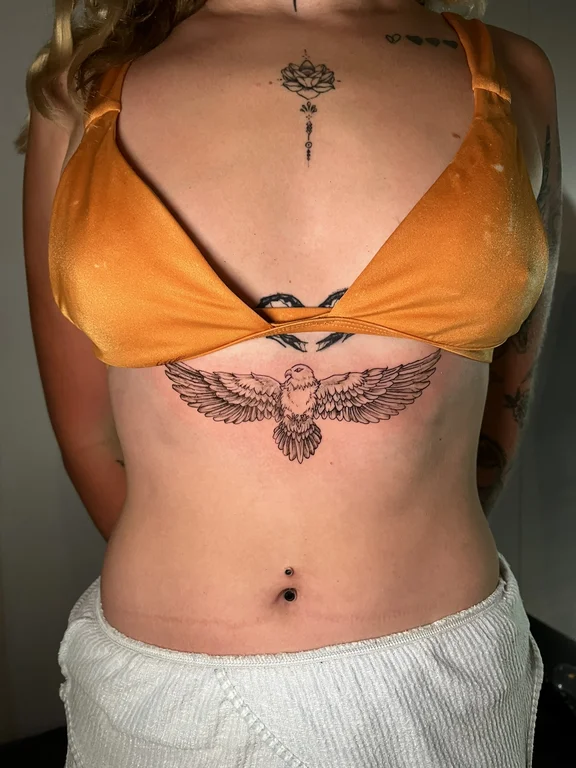 animal blackwork angel fine line elegant phoenix soft shading linework tattoo Canggu Bali