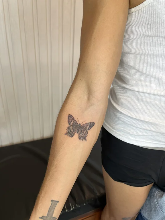 nature blackwork butterfly dotwork minimal soft shading black grey elegant tattoo Canggu Bali