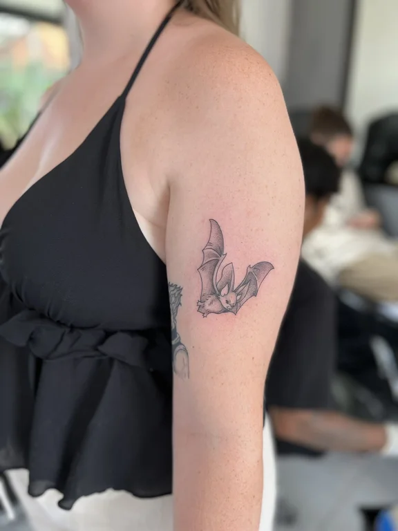 animal blackwork butterfly linework elegant fine line soft shading woman tattoo Canggu Bali
