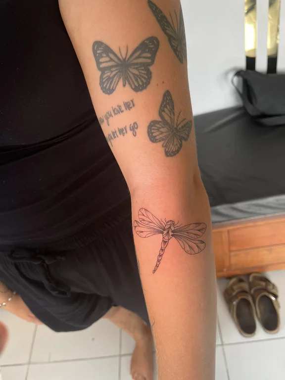 nature blackwork butterfly soft shading elegant black grey fine line dotwork tattoo Canggu Bali