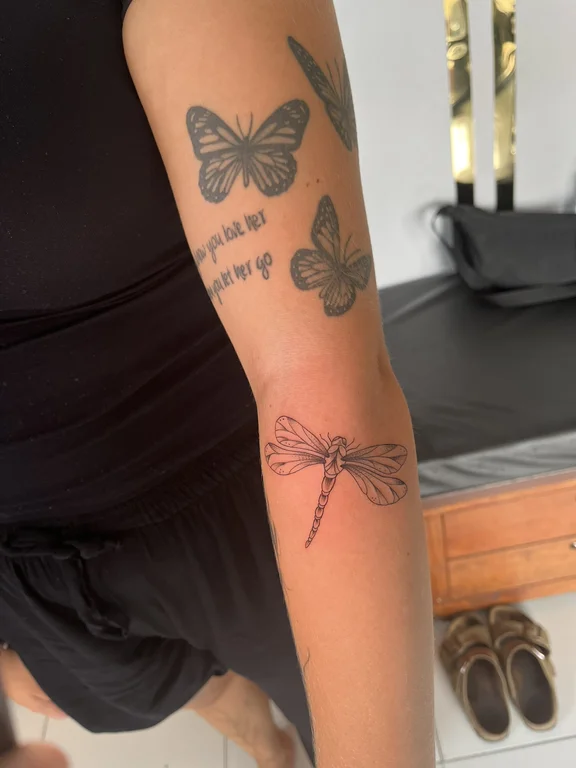 lettering blackwork butterfly soft shading elegant black grey spiritual fine line tattoo Canggu Bali