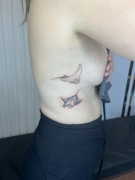 animal blackwork koi soft shading elegant minimal black grey fine line tattoo Canggu Bali