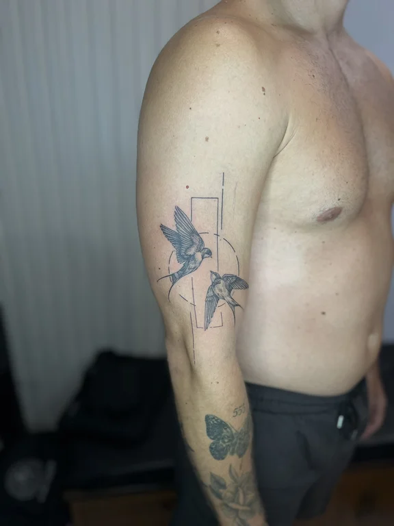 animal blackwork man black grey elegant linework soft shading minimal tattoo Canggu Bali