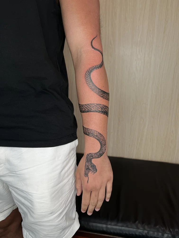 man hand snake black blackwork animal shading tattoo canggu bali