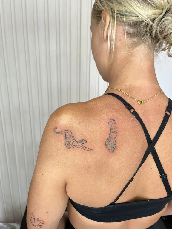 animal blackwork snake fine line elegant linework minimal dotwork tattoo Canggu Bali
