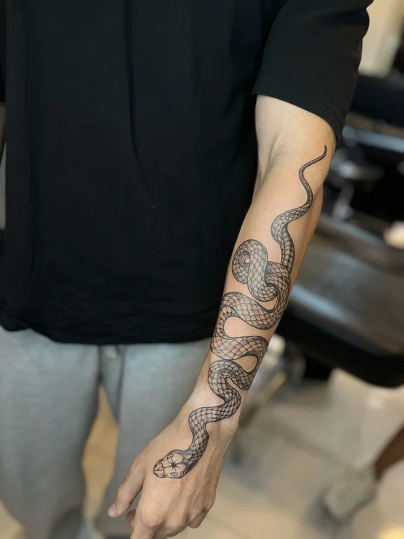 snake linework dotwork elegant heavy shading tattoo canggu bali