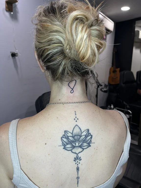 floral blackwork lotus dotwork elegant black grey soft shading fine line tattoo Canggu Bali