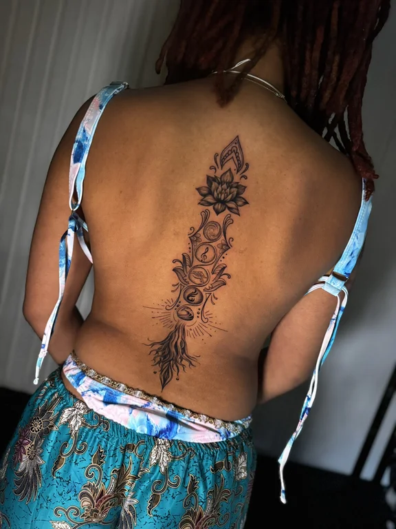 floral blackwork lotus linework elegant spiritual rose soft shading tattoo Canggu Bali
