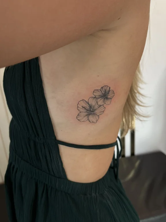 floral blackwork peony fine line elegant soft shading linework minimal tattoo Canggu Bali