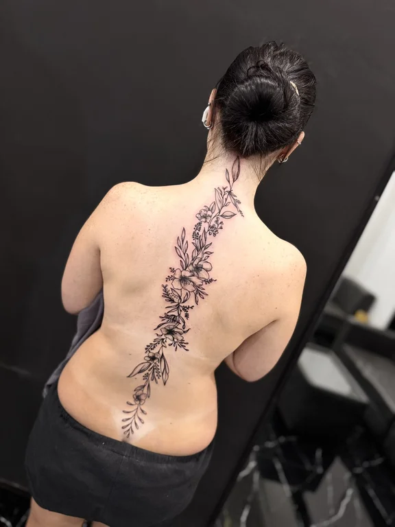 floral blackwork peony linework elegant fine line soft shading dotwork tattoo Canggu Bali