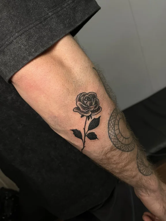 floral blackwork rose black grey elegant dotwork soft shading fine line tattoo Canggu Bali