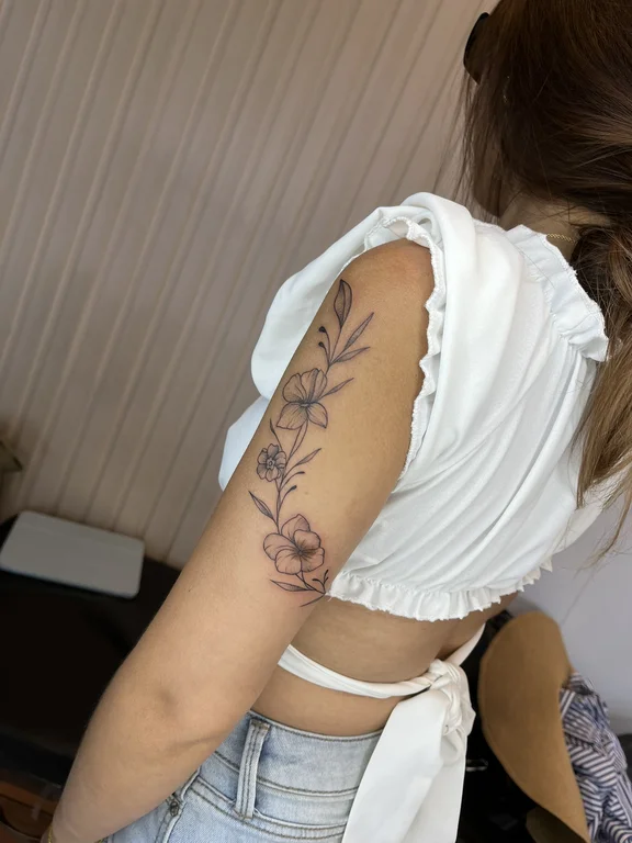 floral blackwork rose linework elegant soft shading fine line mystical tattoo Canggu Bali