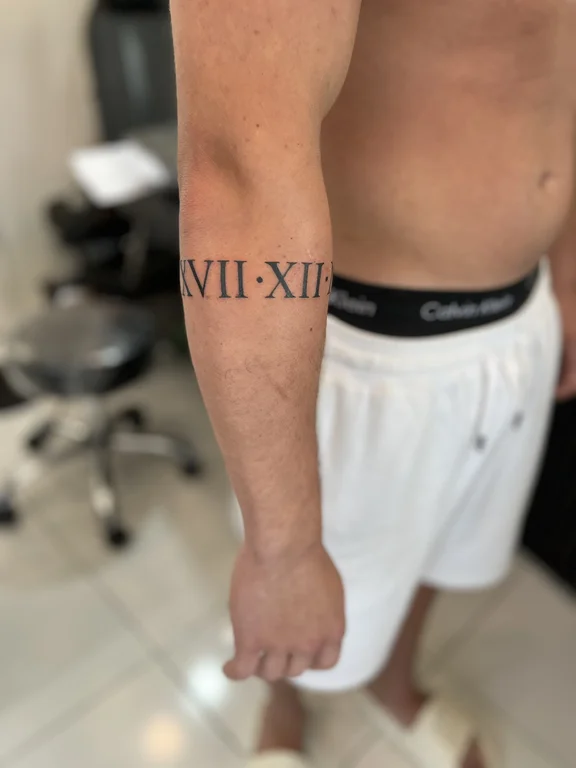 lettering blackwork man bold line minimal fine line thin line soft shading tattoo Canggu Bali