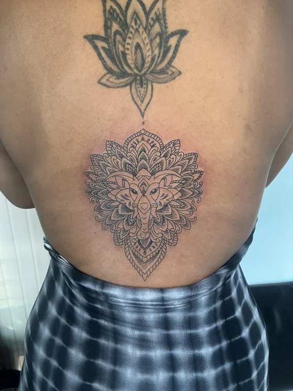 mandala blackwork lion dotwork spiritual black grey linework balinese pattern tattoo Canggu Bali