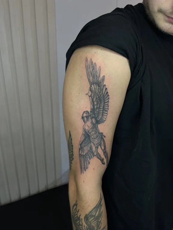 mythology blackwork angel black grey elegant soft shading man linework tattoo Canggu Bali