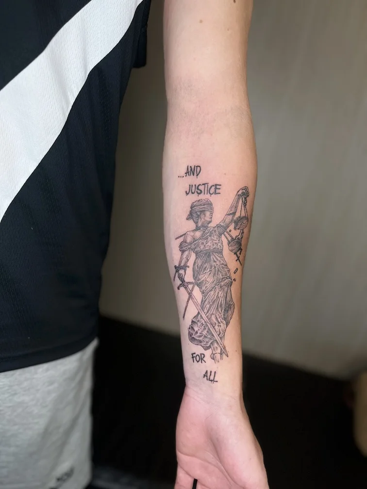 black man hand mythology tattoo linework justice fine tattoo canggu bali