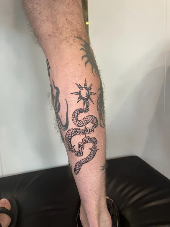 mythology blackwork snake dotwork sun dragon linework deity tattoo Canggu Bali