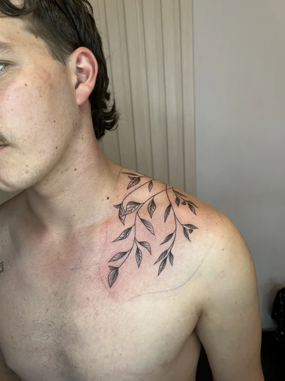 nature blackwork man soft shading leaf elegant linework fine line tattoo Canggu Bali