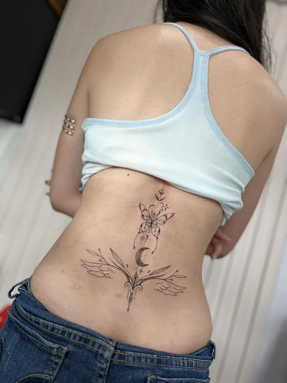 nature blackwork woman linework elegant fine line flower soft shading tattoo Canggu Bali