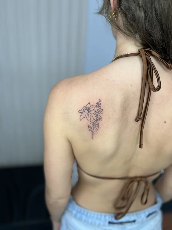 nature blackwork woman linework flower dotwork soft shading elegant tattoo Canggu Bali