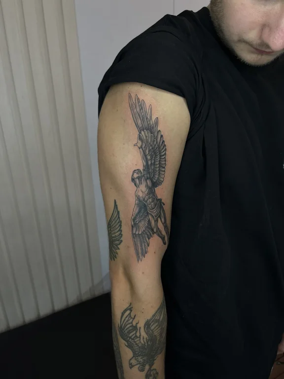 religious blackwork angel black grey cloud dragon linework heavy shading tattoo Canggu Bali