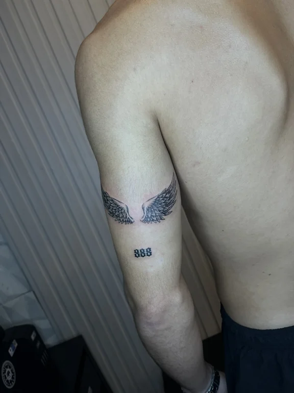 symbol blackwork angel dotwork elegant black grey fine line man tattoo Canggu Bali