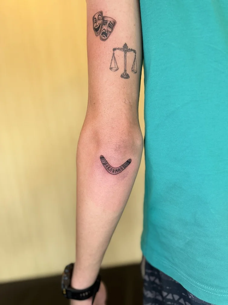 black blackwork boomerang man arm tattoo line tattoo canggu bali