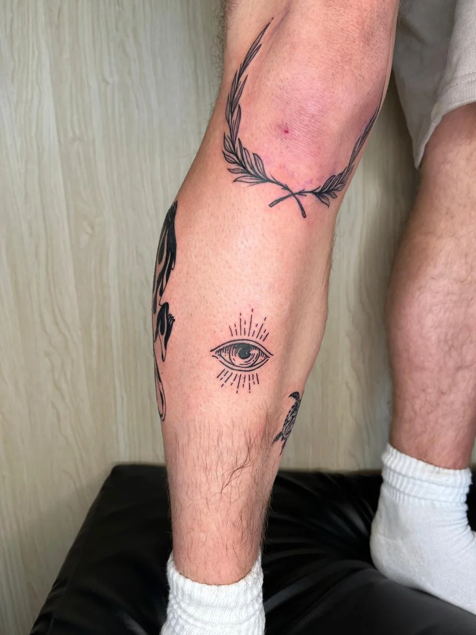 man leg foot eye symbol blackwork black tattoo canggu bali