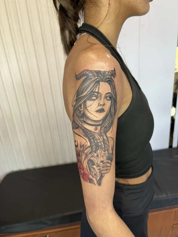 portrait chicano woman heavy shading spiritual linework black grey angel tattoo Canggu Bali