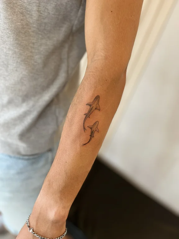 animal minimalist man fine line wave minimal linework elegant tattoo Canggu Bali