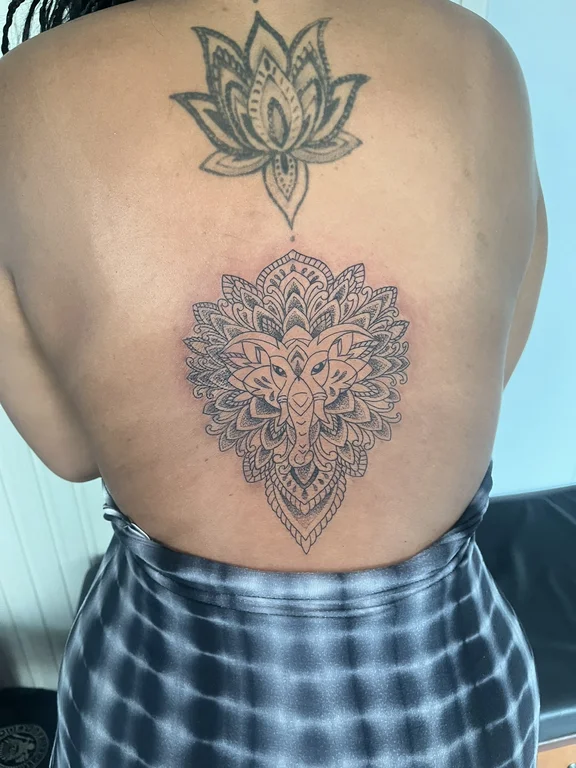 mandala dotwork lion balinese pattern spiritual lotus linework black grey tattoo Canggu Bali