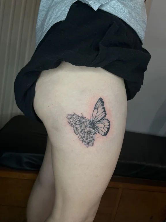 nature dotwork butterfly soft shading elegant black grey fine line flower tattoo Canggu Bali