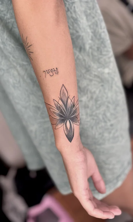 symbol dotwork lotus black grey spiritual leaf elegant soft shading tattoo Canggu Bali
