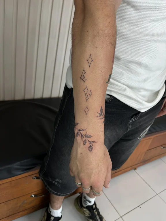 abstract fine line hand linework minimal elegant dotwork leaf tattoo Canggu Bali