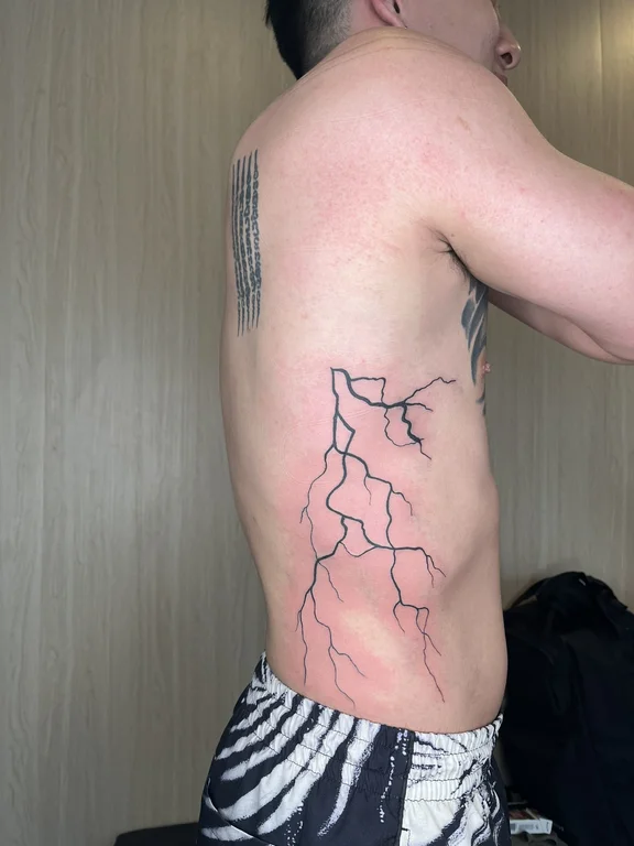 abstract fine line man linework cloud bold line minimal dotwork tattoo Canggu Bali
