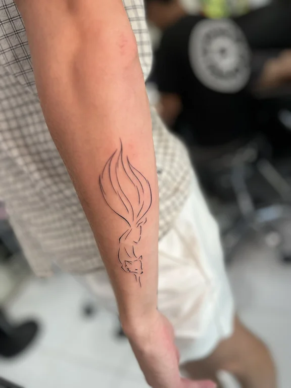 abstract fine line phoenix linework fire spiritual bold line minimal tattoo Canggu Bali