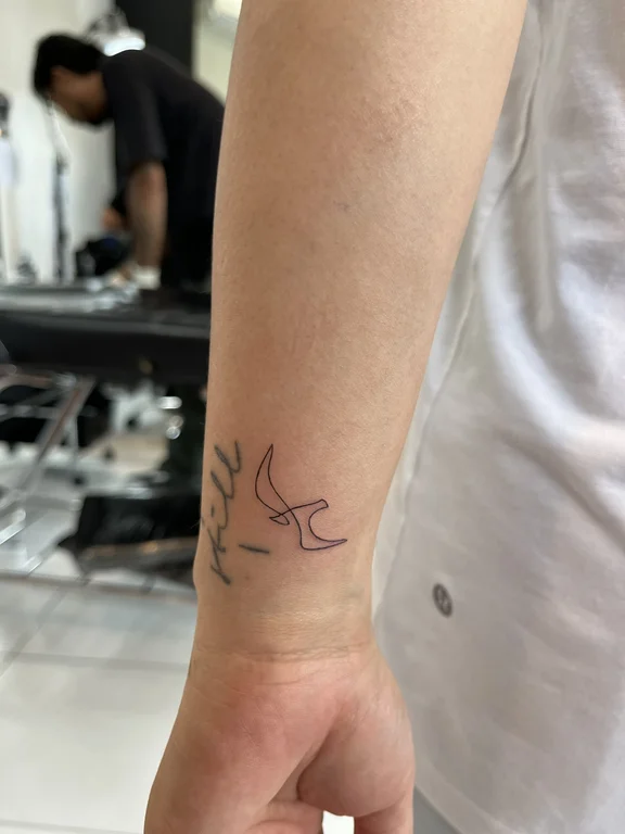 abstract fine line snake bold line minimal elegant linework soft shading tattoo Canggu Bali