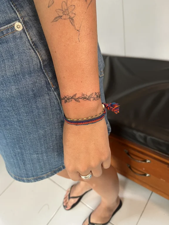 abstract fine line snake thin line wave minimal colorful elegant tattoo Canggu Bali