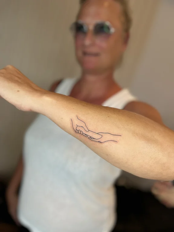 woman bold line linework snake thin line tattoo canggu bali