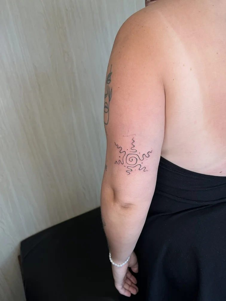 woman hand fine line linework line abstract sun wave tattoo canggu bali