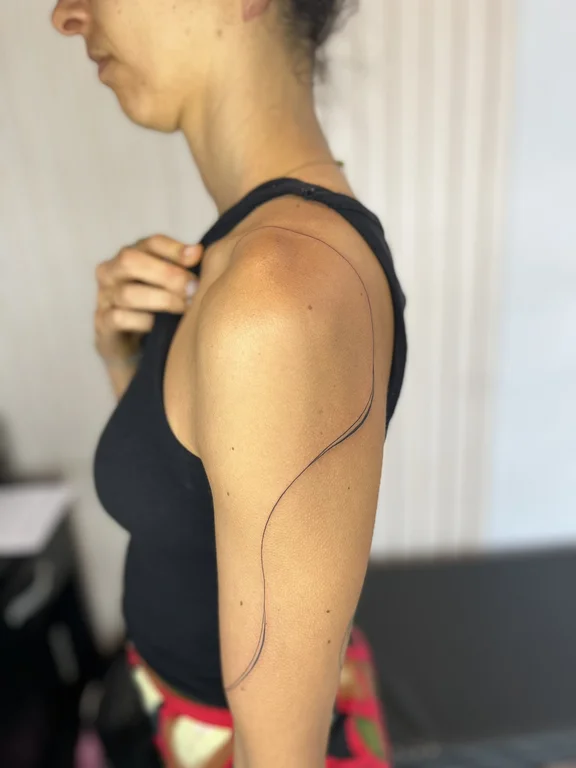 abstract fine line woman linework minimal bold line wave thin line tattoo Canggu Bali
