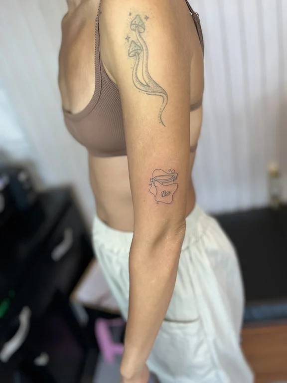 abstract fine line woman linework wave elegant snake dotwork tattoo Canggu Bali