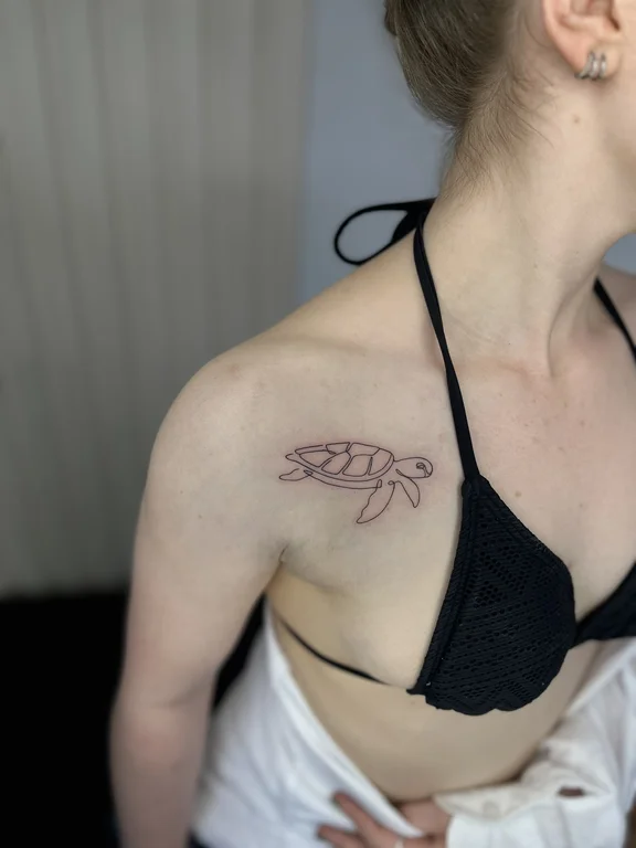 abstract blackwork koi linework elegant minimal fine line leaf tattoo Canggu Bali