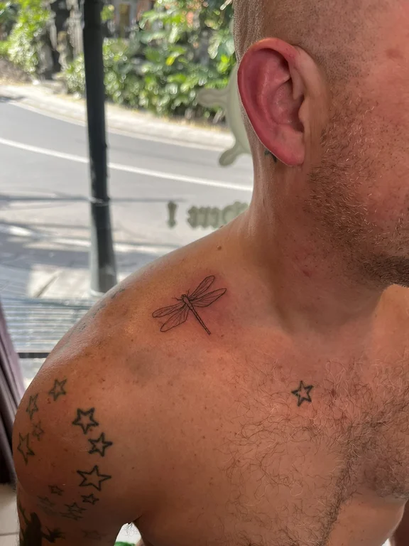 symbol blackwork man fine line minimal dotwork linework soft shading tattoo Canggu Bali