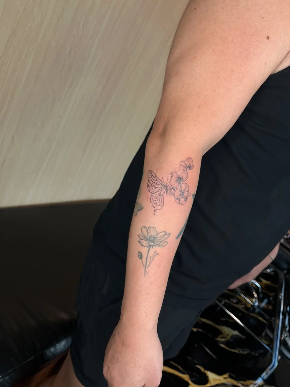 man hand butterfly animal fine line line work line surrealism flower tattoo canggu bali